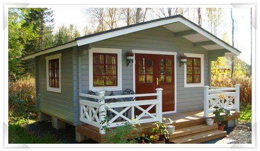 GardenLife's Deben log cabin painted in pale green and brown