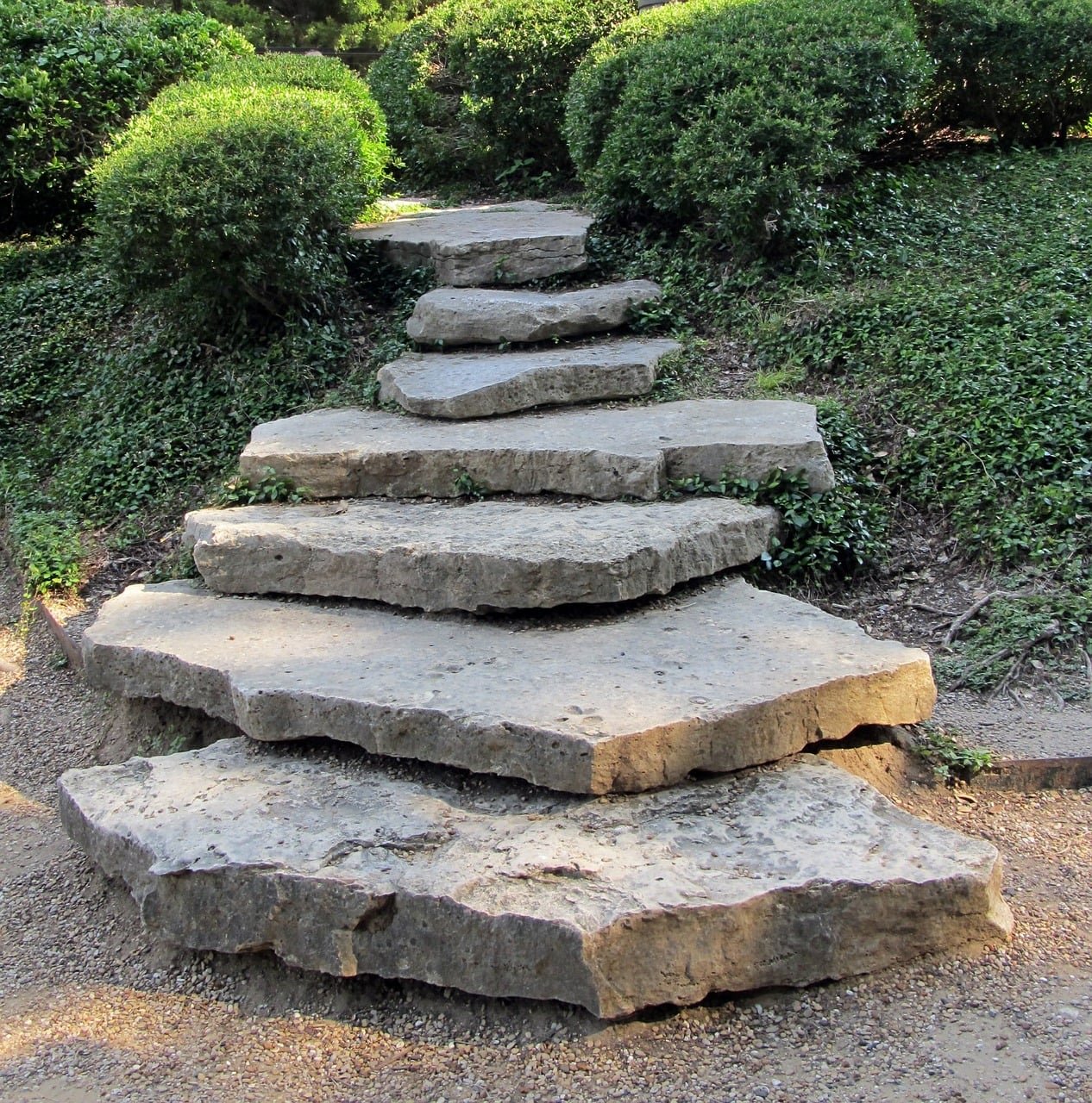 Using boulders to create steps to a garden path