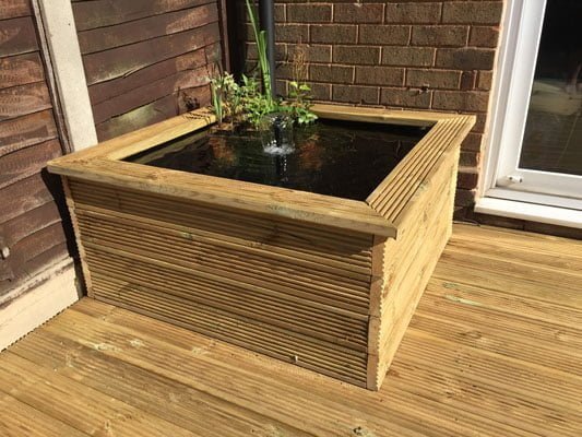 Raised garden pond made from garden decking