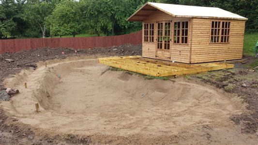 Summer house decking over a pond